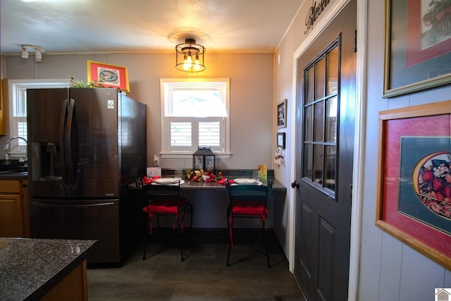 kitchen featuring sink and stainless steel refrigerator with ice dispenser