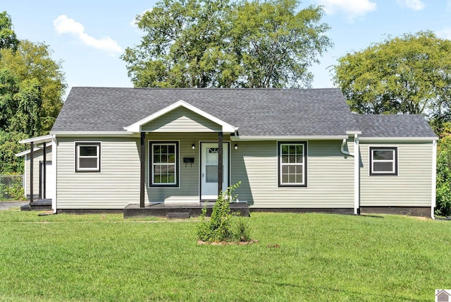 view of front of property featuring covered porch and a front yard