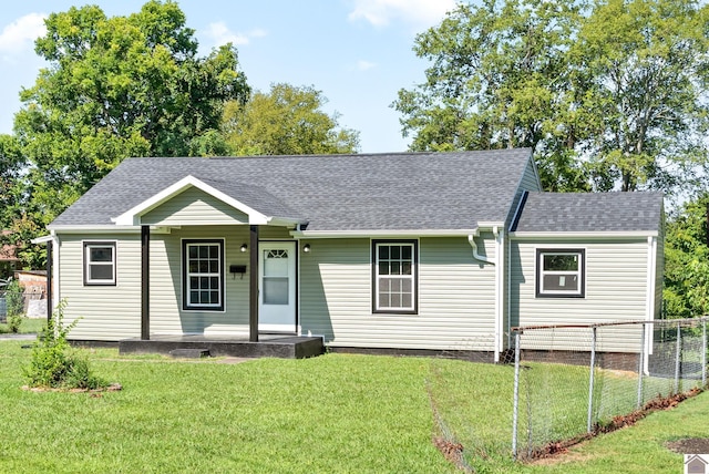 single story home with a front lawn and covered porch