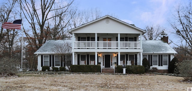 view of front of property with a porch and a balcony