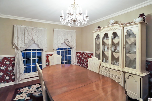 dining area with a chandelier, crown molding, and hardwood / wood-style flooring