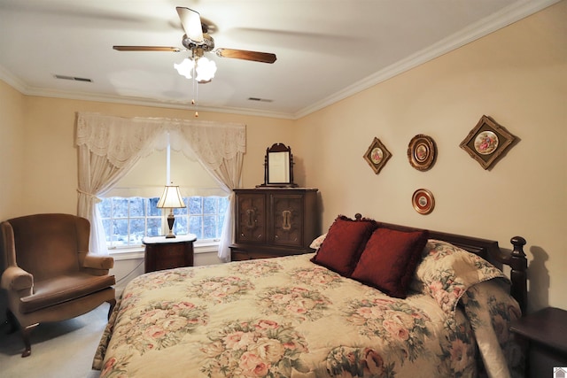 bedroom with ceiling fan, carpet, and crown molding