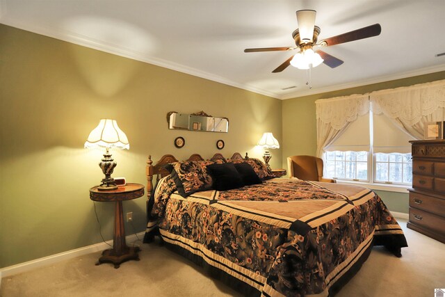 bedroom with ceiling fan, carpet flooring, and ornamental molding