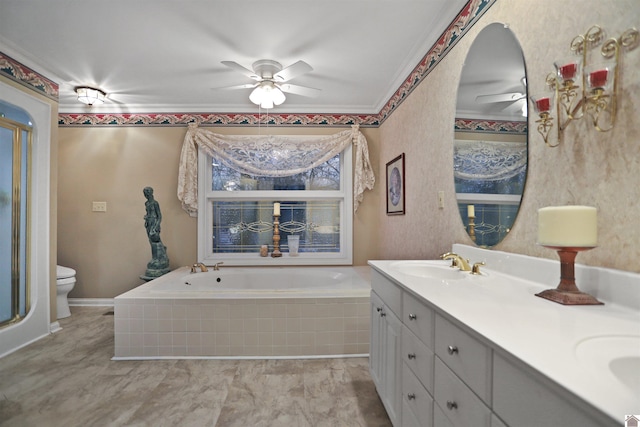 bathroom featuring toilet, vanity, ceiling fan, tiled tub, and crown molding