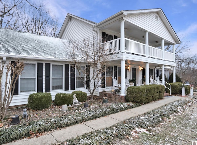 view of front of home featuring a porch and a balcony