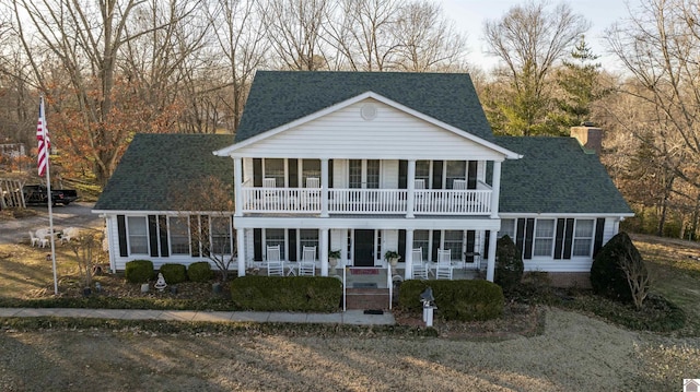 view of front of home with a balcony and covered porch