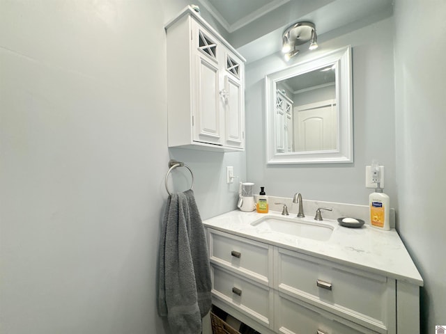 bathroom featuring vanity and crown molding