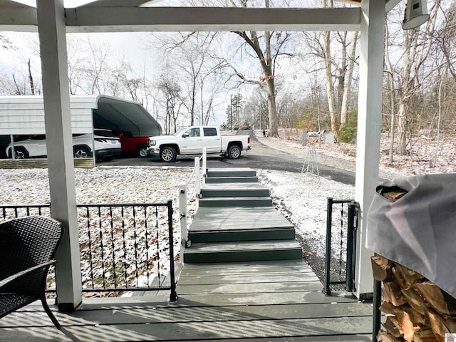 exterior space featuring a carport and a grill