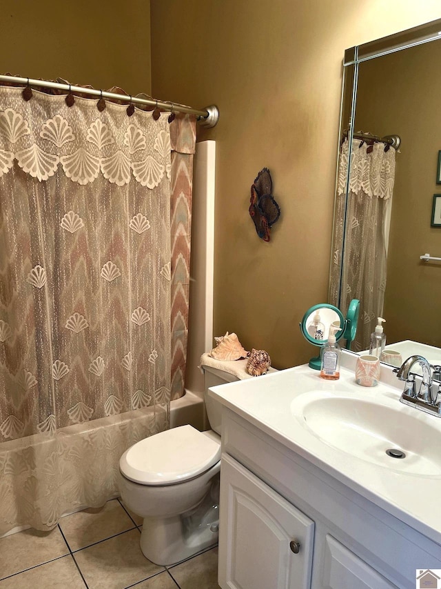 full bathroom featuring tile patterned floors, vanity, toilet, and shower / tub combo with curtain