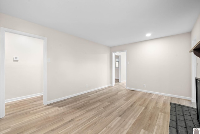 unfurnished living room featuring light hardwood / wood-style floors