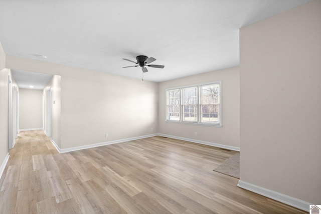 spare room featuring ceiling fan and light wood-type flooring