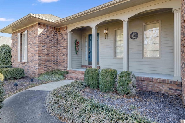 doorway to property featuring a porch