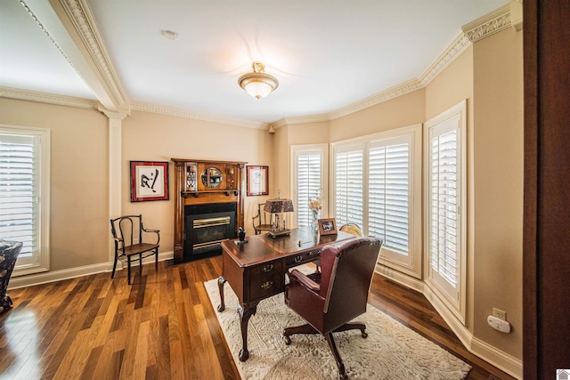 office featuring ornamental molding, dark wood-type flooring, and decorative columns