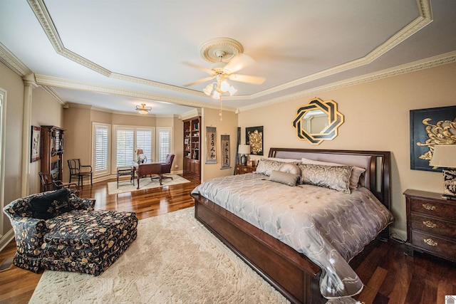 bedroom with ceiling fan, crown molding, and hardwood / wood-style flooring