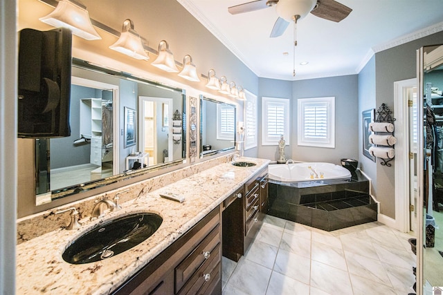 bathroom with tile patterned floors, vanity, crown molding, and a relaxing tiled tub