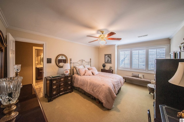 carpeted bedroom featuring ceiling fan, crown molding, and connected bathroom