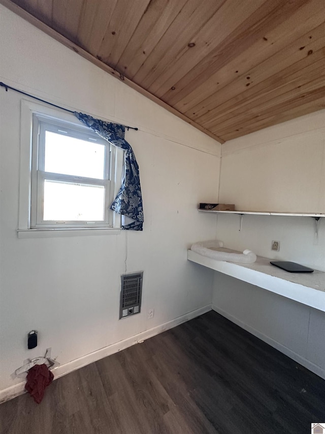 laundry room with wooden ceiling, dark wood-type flooring, and heating unit