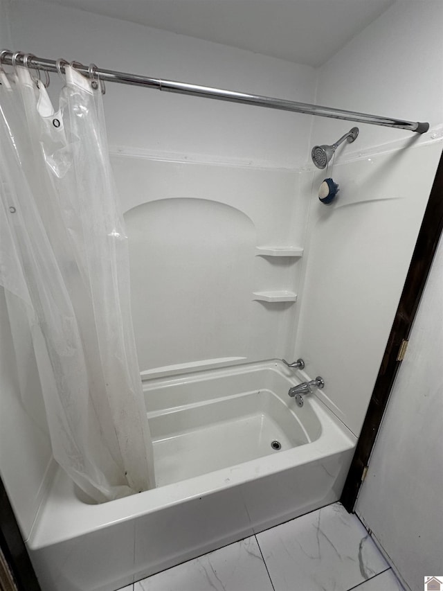 bathroom with shower / tub combo