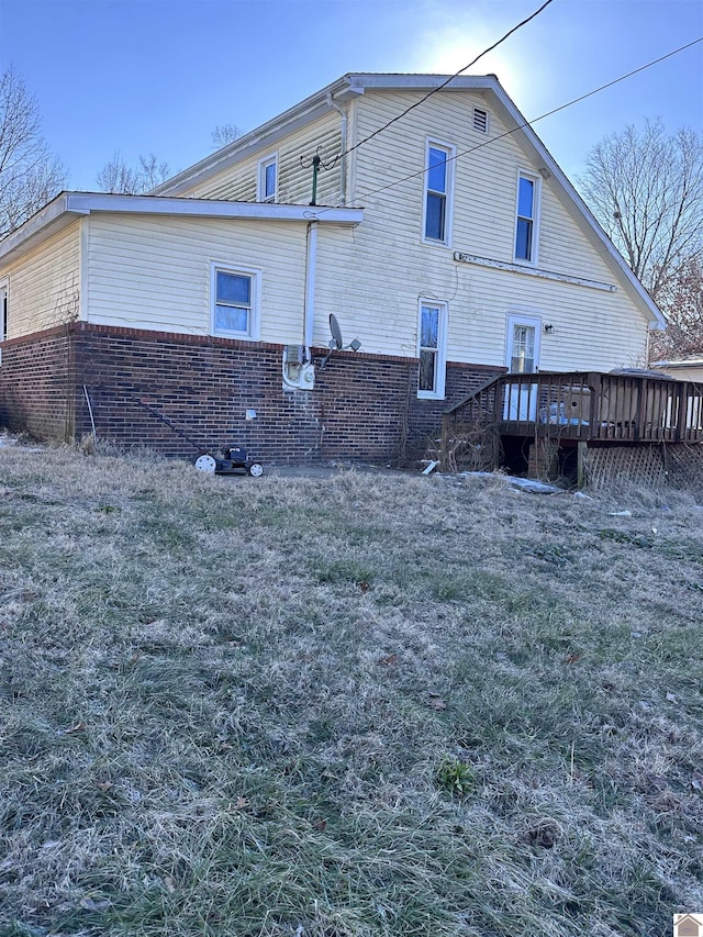 view of side of property with a deck