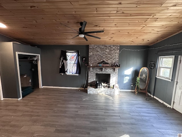 unfurnished living room featuring hardwood / wood-style floors, a brick fireplace, and wooden ceiling