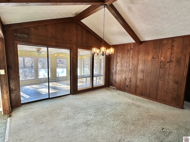 interior space with lofted ceiling with beams, a textured ceiling, ceiling fan with notable chandelier, and light carpet