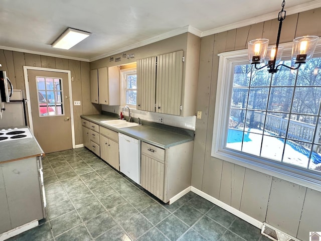 kitchen featuring sink, a chandelier, decorative light fixtures, white appliances, and ornamental molding