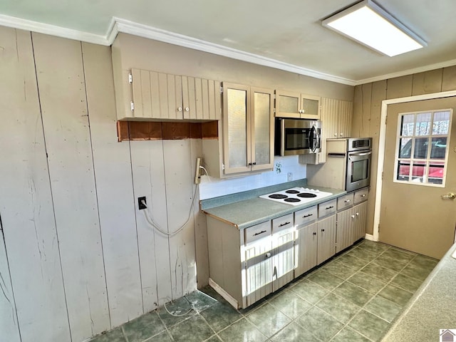 kitchen with ornamental molding and appliances with stainless steel finishes