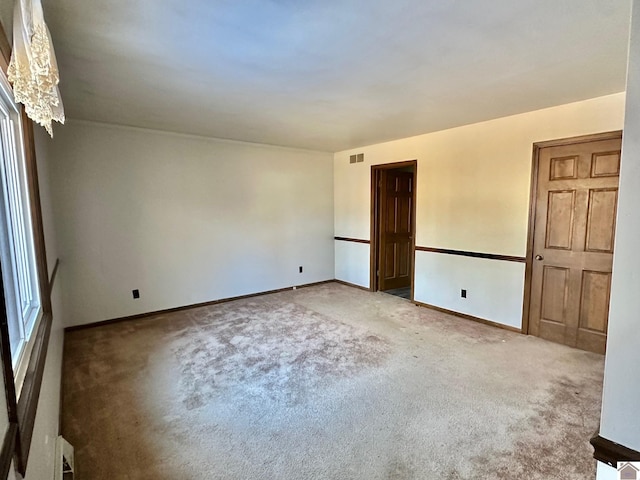 unfurnished room with carpet floors