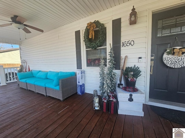 deck with ceiling fan and a porch