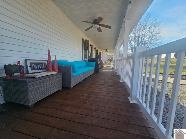 wooden deck featuring ceiling fan