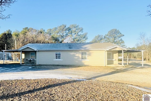 exterior space with a carport