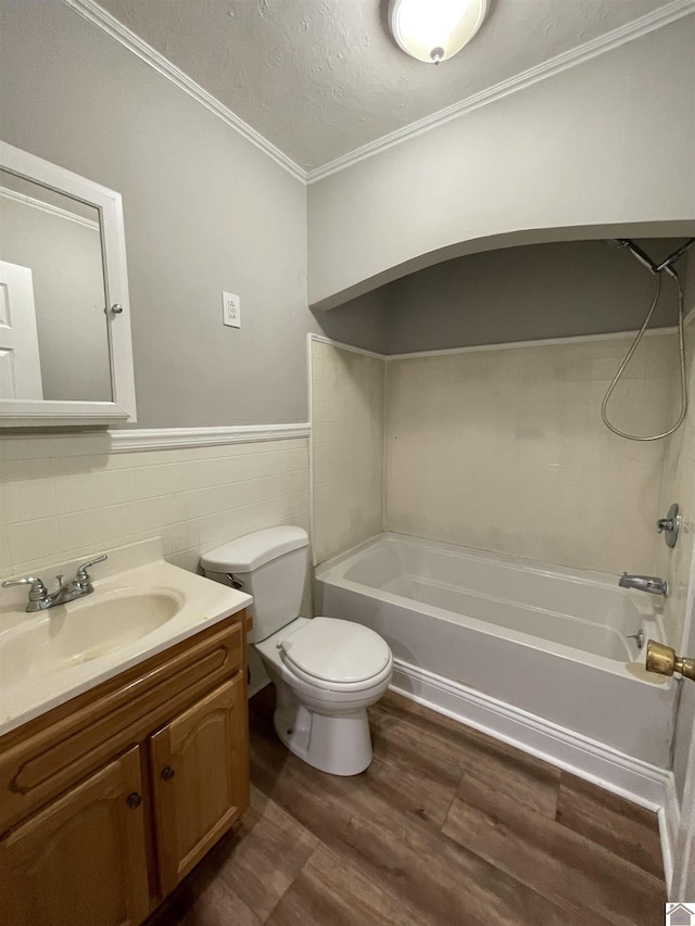 full bathroom with wood-type flooring, shower / tub combination, a textured ceiling, and tile walls