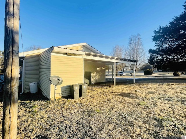 view of side of home featuring a carport