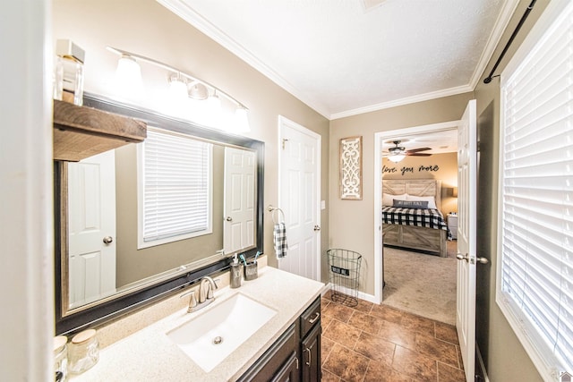 bathroom featuring a textured ceiling, vanity, ceiling fan, and crown molding