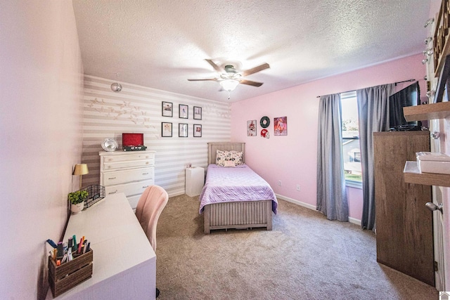 carpeted bedroom with ceiling fan and a textured ceiling