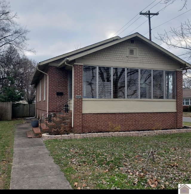 view of front of house with a sunroom