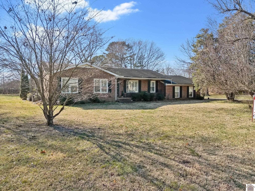 ranch-style house with a front lawn