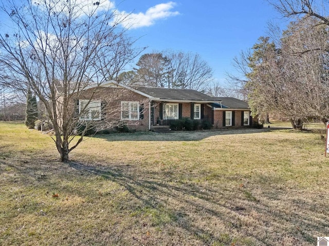 ranch-style house with a front lawn