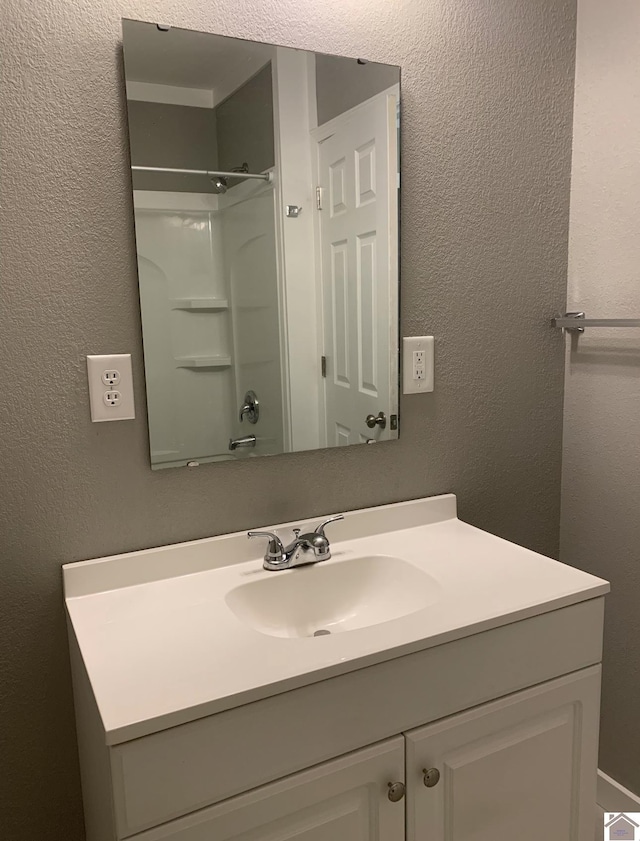 bathroom with vanity and shower / bathtub combination