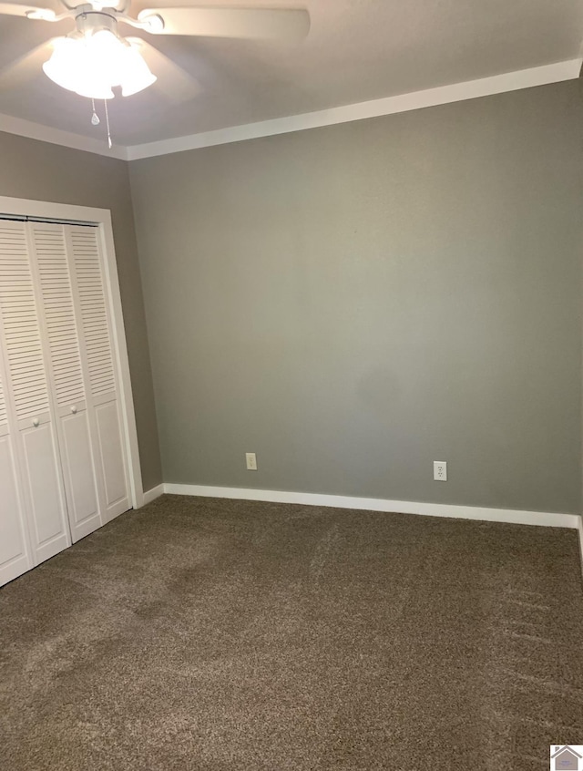 unfurnished bedroom featuring ceiling fan, a closet, and carpet