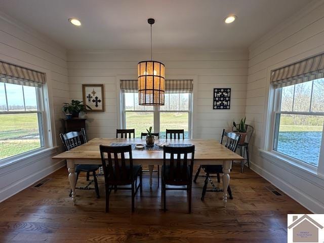 dining area featuring a chandelier and dark wood-type flooring