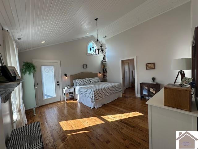 bedroom with dark hardwood / wood-style flooring, an inviting chandelier, and vaulted ceiling