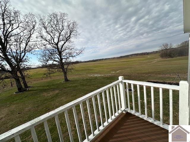 balcony featuring a rural view