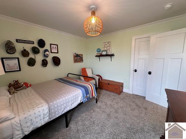 bedroom featuring light colored carpet and crown molding