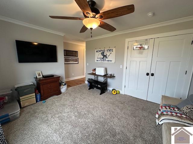 interior space featuring ceiling fan and ornamental molding