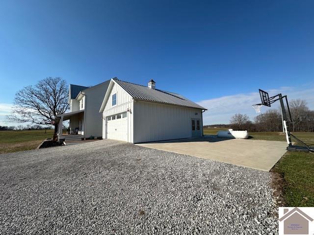 view of side of property featuring a garage