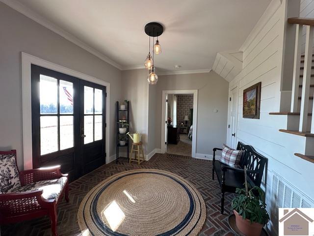 entrance foyer featuring french doors and ornamental molding