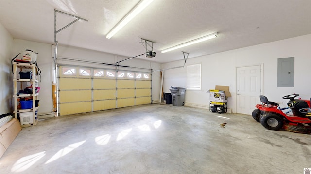 garage with a garage door opener and electric panel