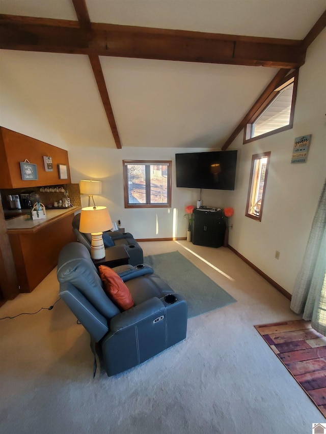 carpeted living room with lofted ceiling with beams