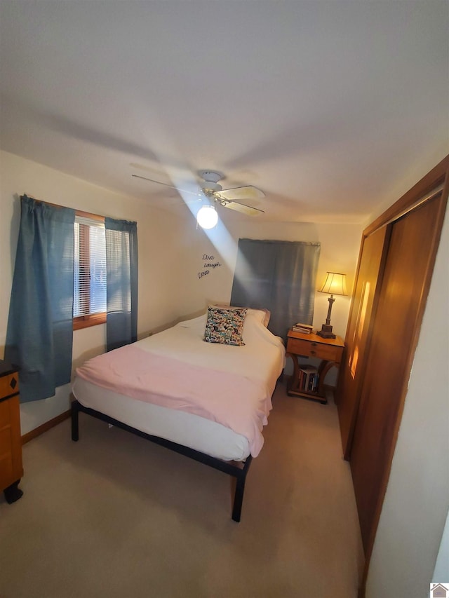 bedroom featuring a closet, ceiling fan, and carpet floors